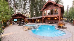 A Mountain-Inspired Getaway In Idaho, This Cabin At Hayden Lake Has A Private Waterfall And Swimming Pool
